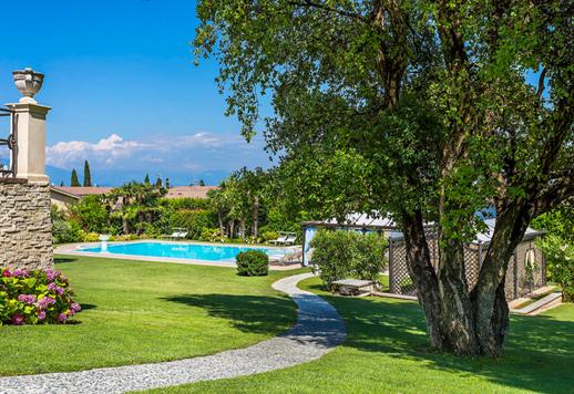 Charming estate for sale with a stunning pool and a wonderful view of the lake's calming waters Image 8