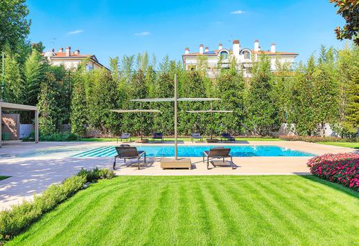 Austere and imposing in its majestic neoclassical architecture, this prestigious private estate has been redesigned as a full-featured modern villa Image 1
